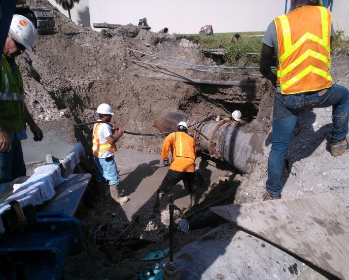 Service workers replace a 36” valve on an effluent deep well disposal main