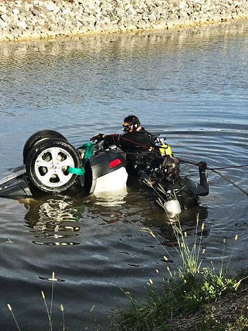 strapping car in water