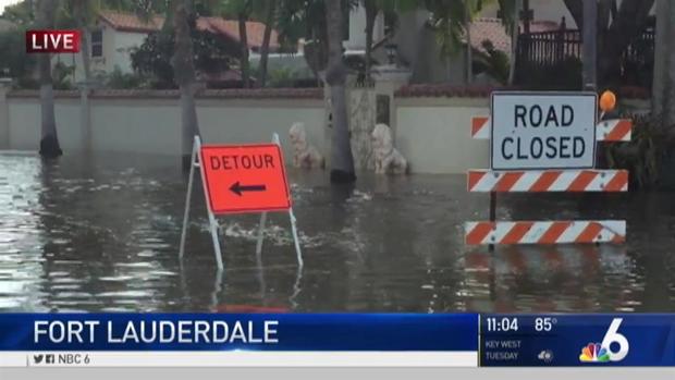 flooded street with signage