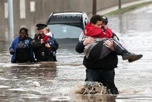 kids being rescued on flooded street