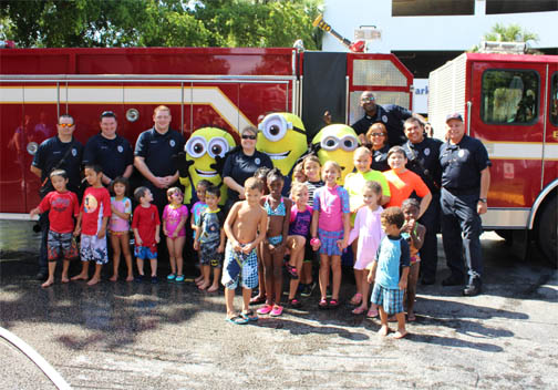 kids and minions by fire truck